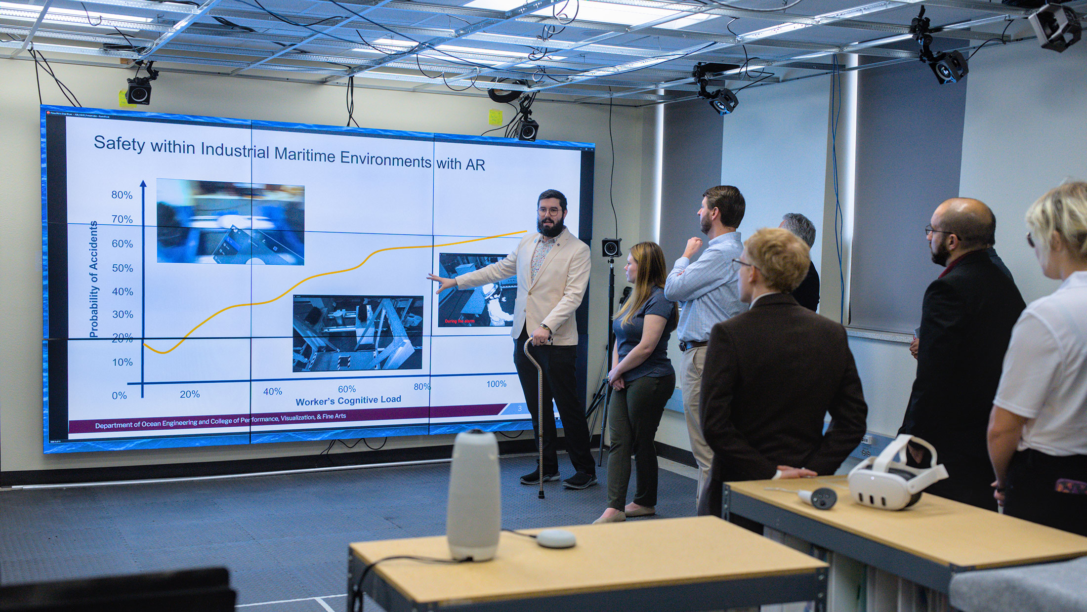 A man giving a presentation on Safety within Industrial Maritime Environments with AR.